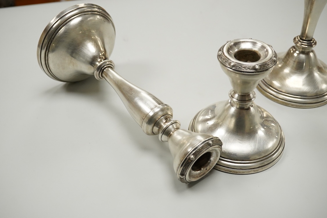 A suite of three Elizabeth II silver mounted candlesticks, comprising a pair, 20.3cm and a single dwarf candlestick, Adie Brothers, Birmingham, 1956.